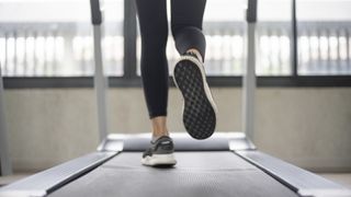 Woman's feet running on a treadmill