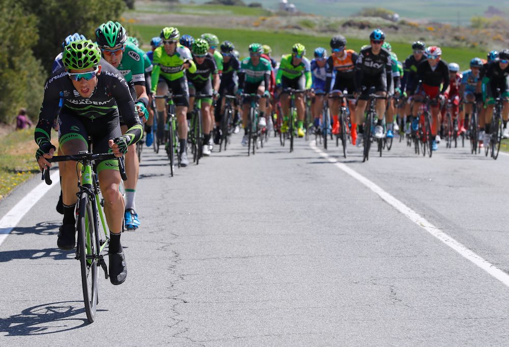A Cycling Academy rider powers the front of the GP Miguel Indurain peloton