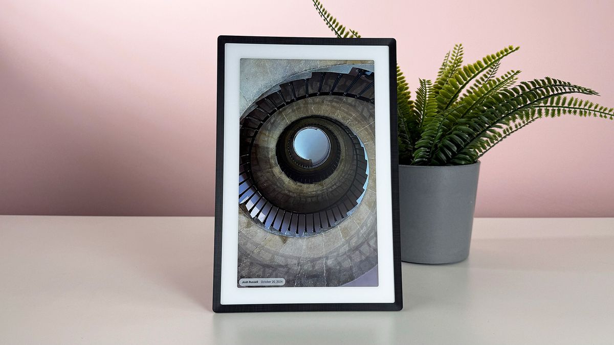 An image of a spiral staircase shot from beneath on the Pexar 11-inch Digital Picture Frame in vertical orientation.