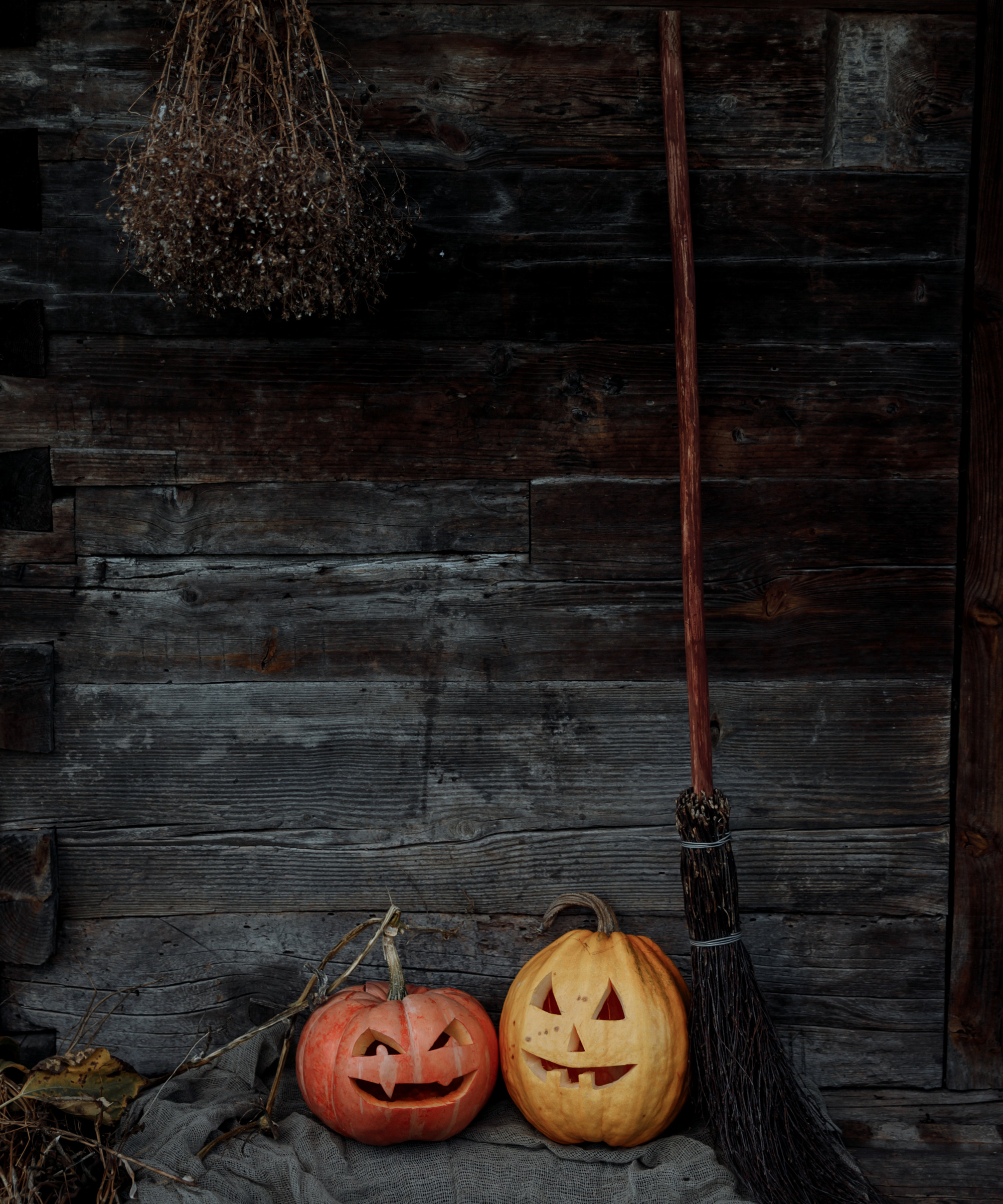 Broomstick with carved pumpkin jack o lanterns - Thirdman from Pexels