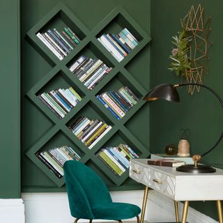 green living room with wall diagonal storage with velvet chair