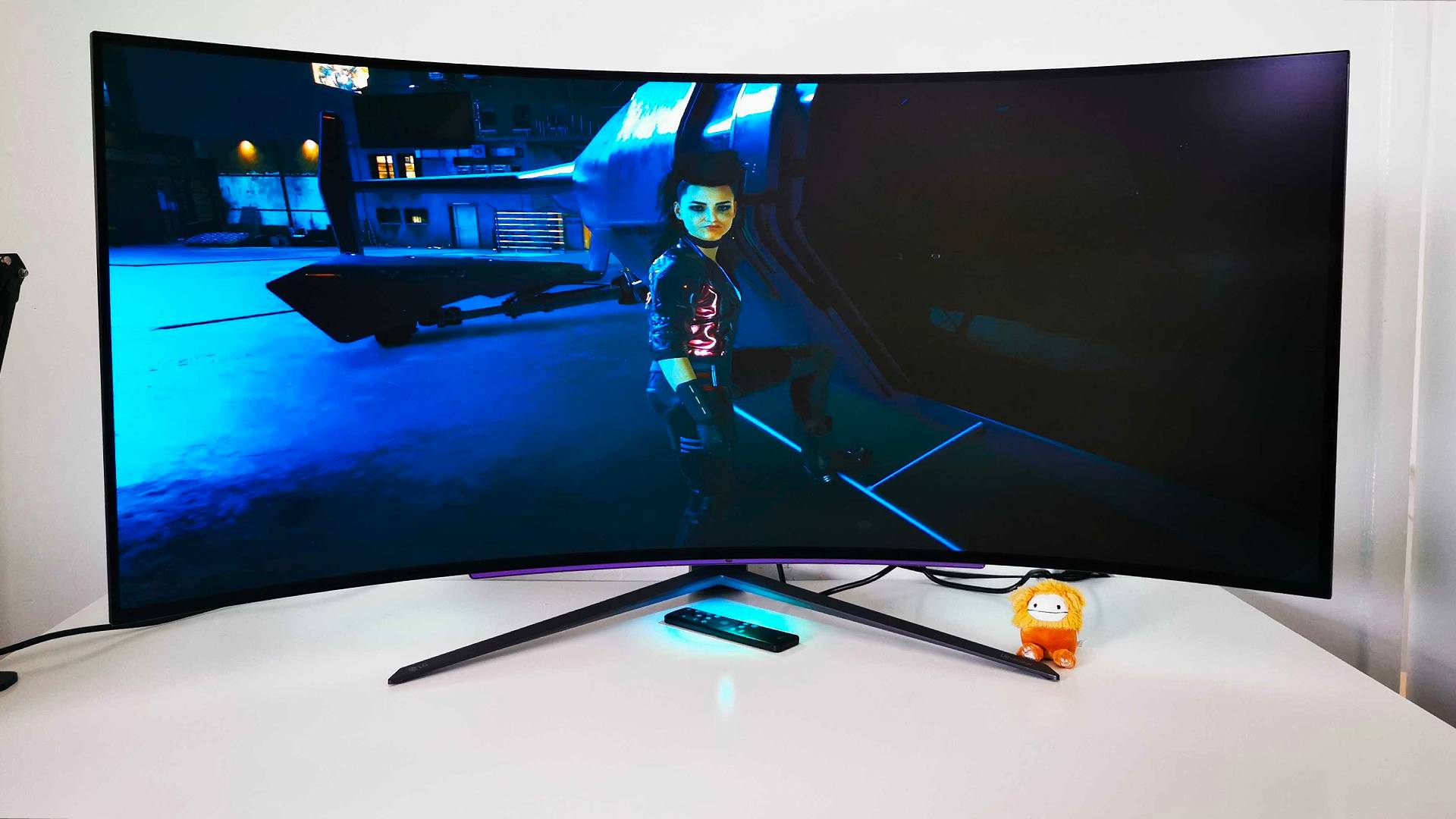 LG UltraGear 45GR95QE with Cyberpunk 2077 gameplay on screen