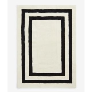 wool rug in cream with black outlines