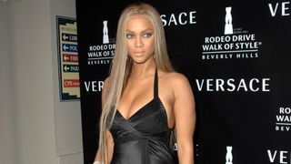 tyra banks at an event with long mushroom blonde hair
