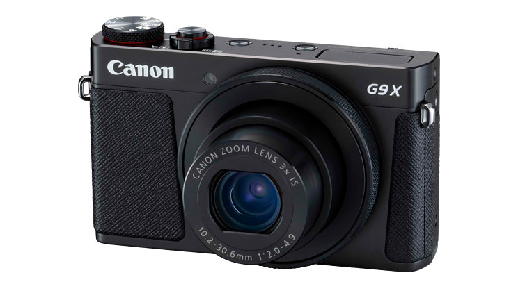 Canon compact camera against a white background