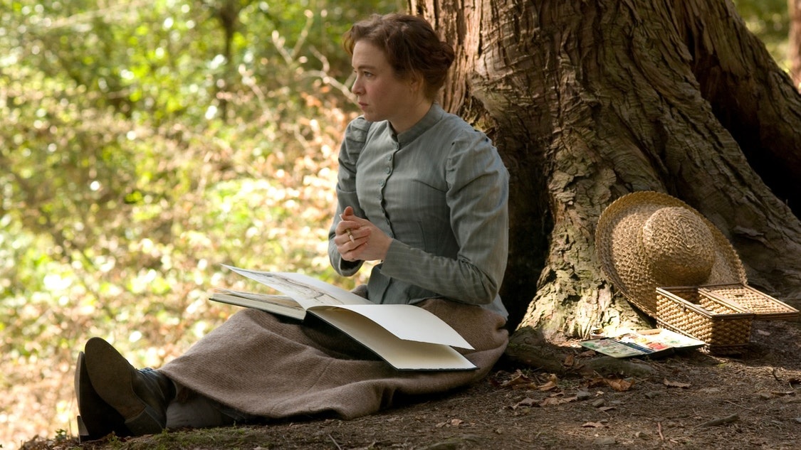 Et billede fra påskefilmen Miss Potter, hvor hovedpersonen sidder under et træ og tegner på en solskinsdag.