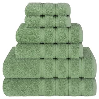 A stack of six neatly folded green cotton towels