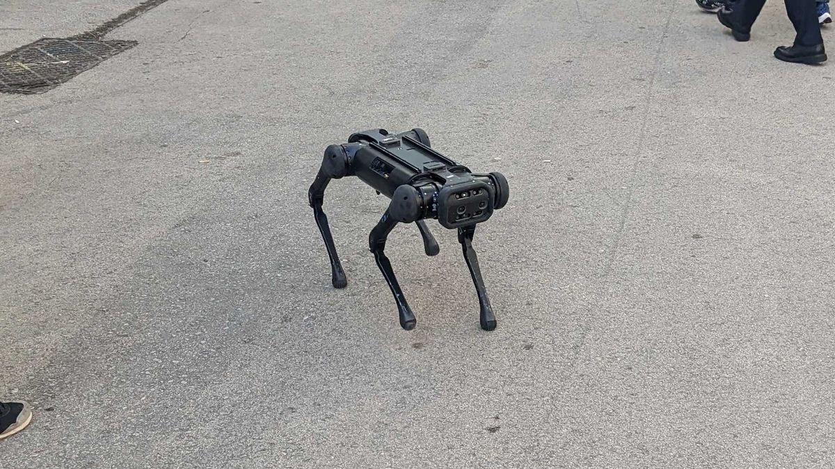 The Xiaomi CyberDog walking around by itself outside MWC 2023.