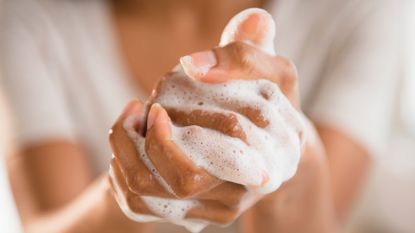 Woman washing her hands