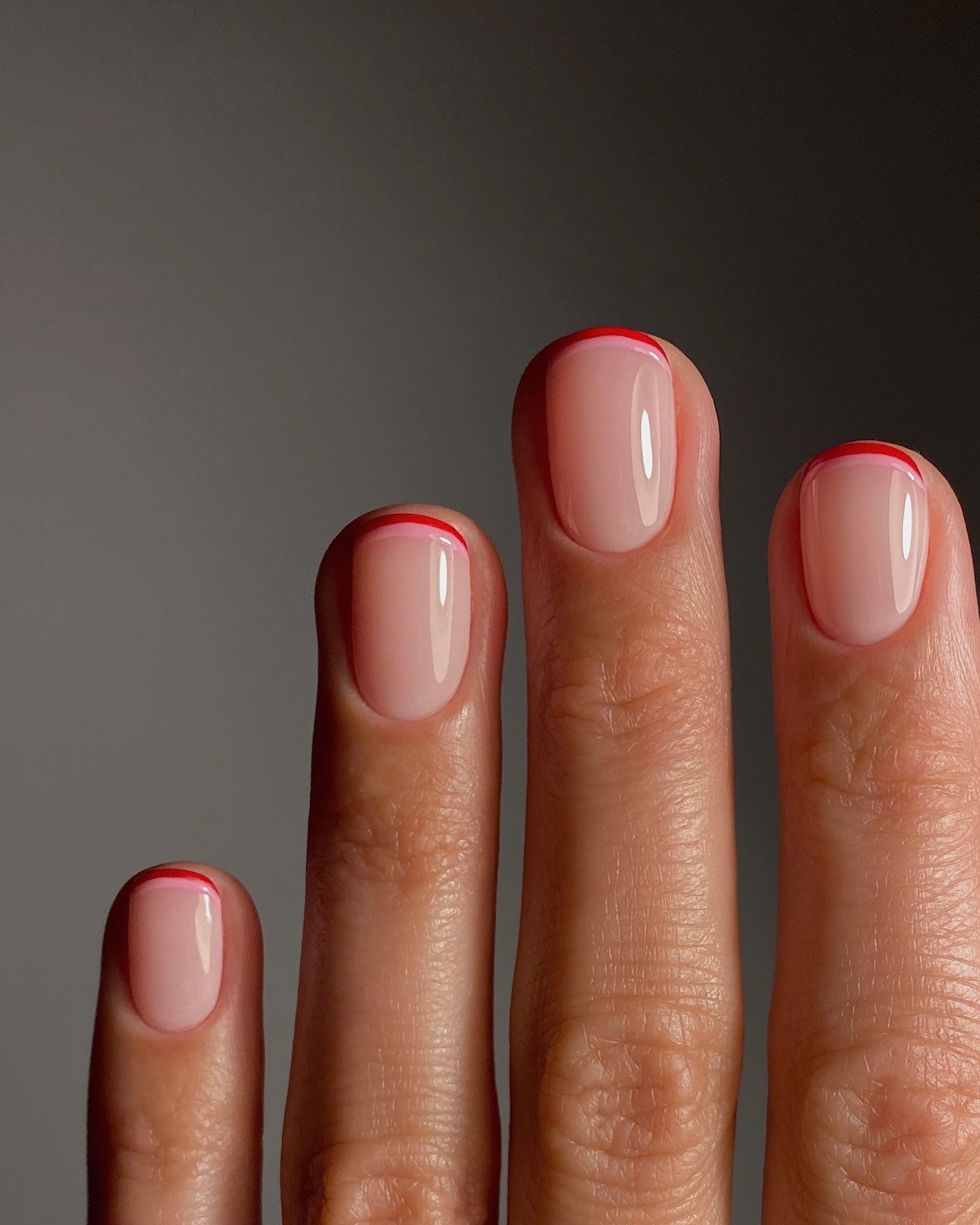 A double French manicure with pink and red colours