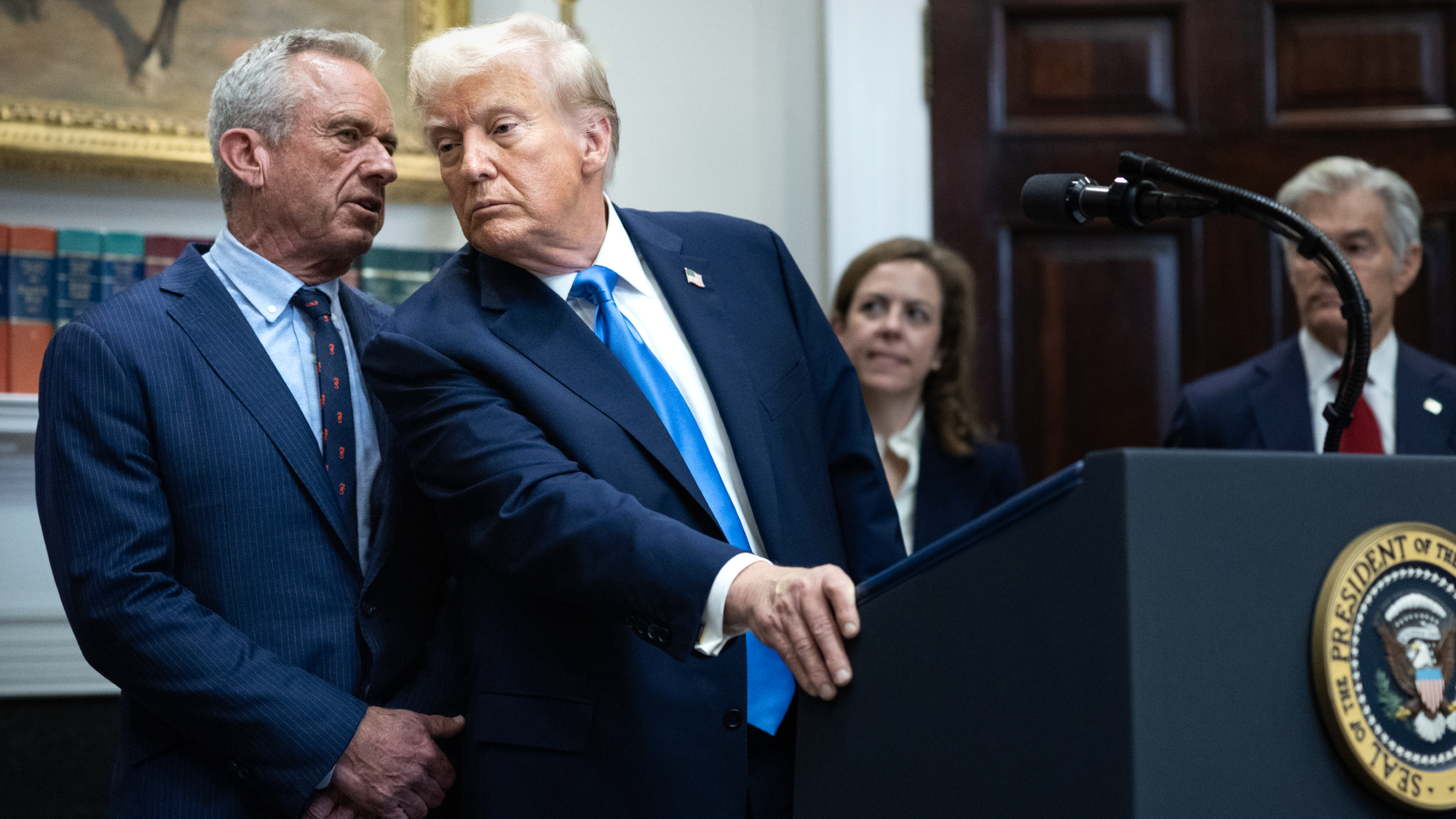 President Donald Trump listens to Health Secretary Robert F. Kennedy Jr.