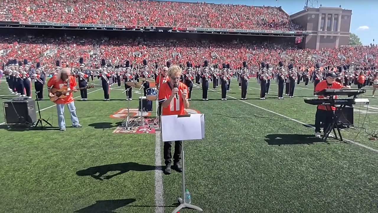 REO Speedwagon perform with the Marching Illini at Gies Memorial Stadium in Champaign, Illinois,