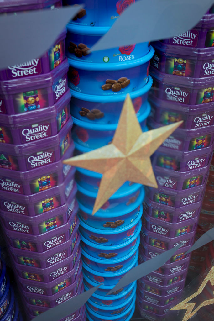 Quality Street stack of boxes next to Roses stack of boxes