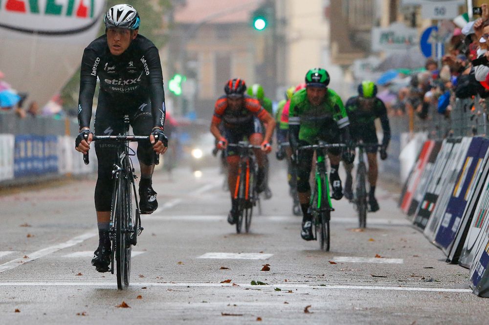 Matteo Trentin crosses the line for second.