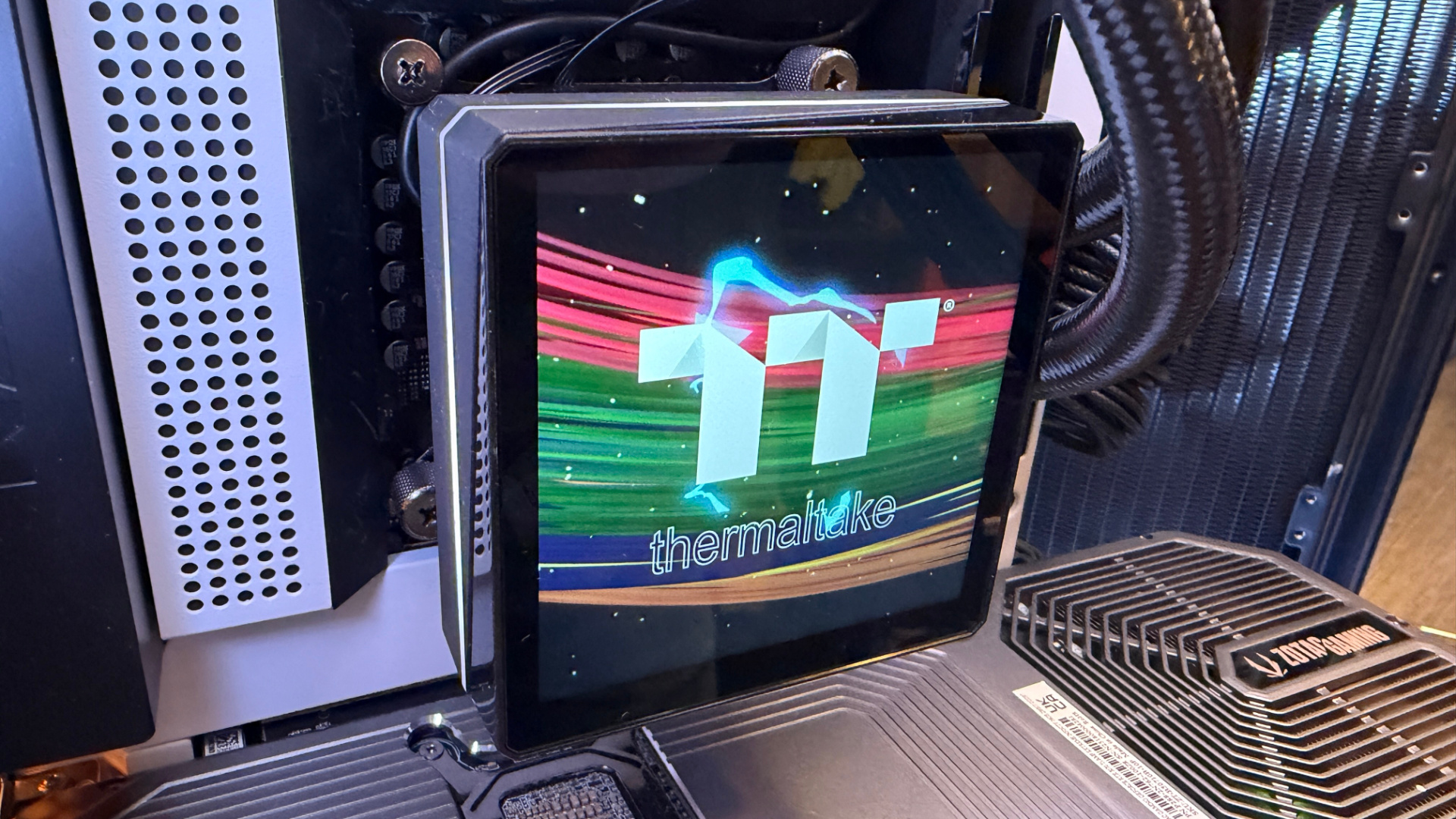 Thermaltake TH360 V3 Ultra ARGB Sync outside of a PC case with fans installed.