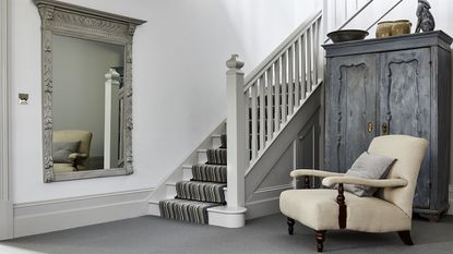 Grey hallway ideas by Carpetright with ornate mirror idea, cream armchair and wardrobe
