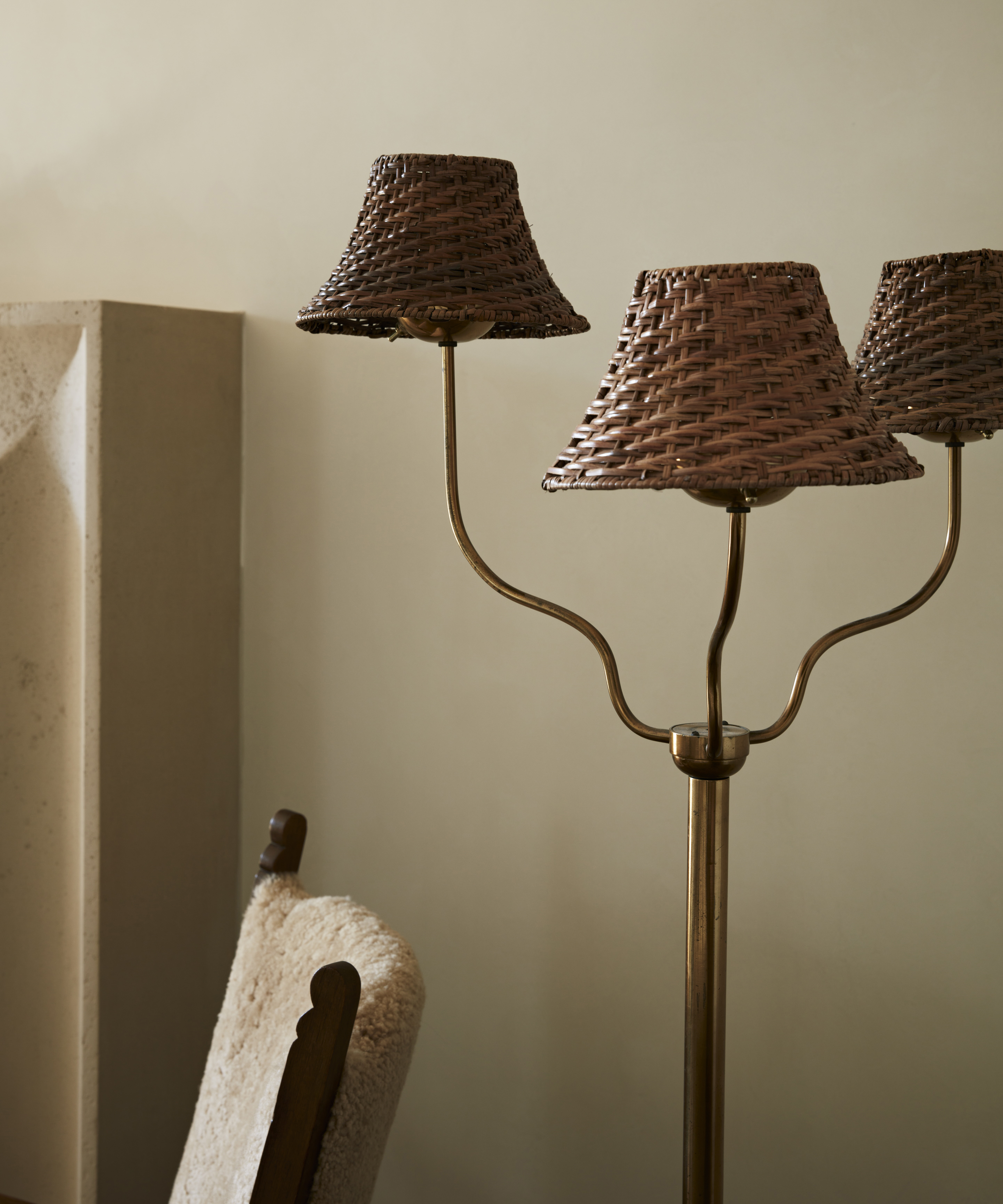 antique floor lamp with three lights in a neutral living room