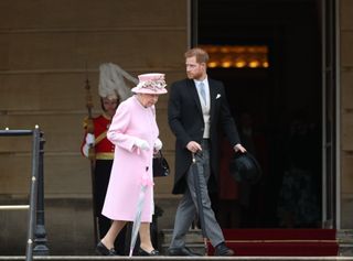 Queen Elizabeth II and Prince Harry, Duke of Sussex attend the Royal Garden Party at Buckingham Palace on May 29, 2019
