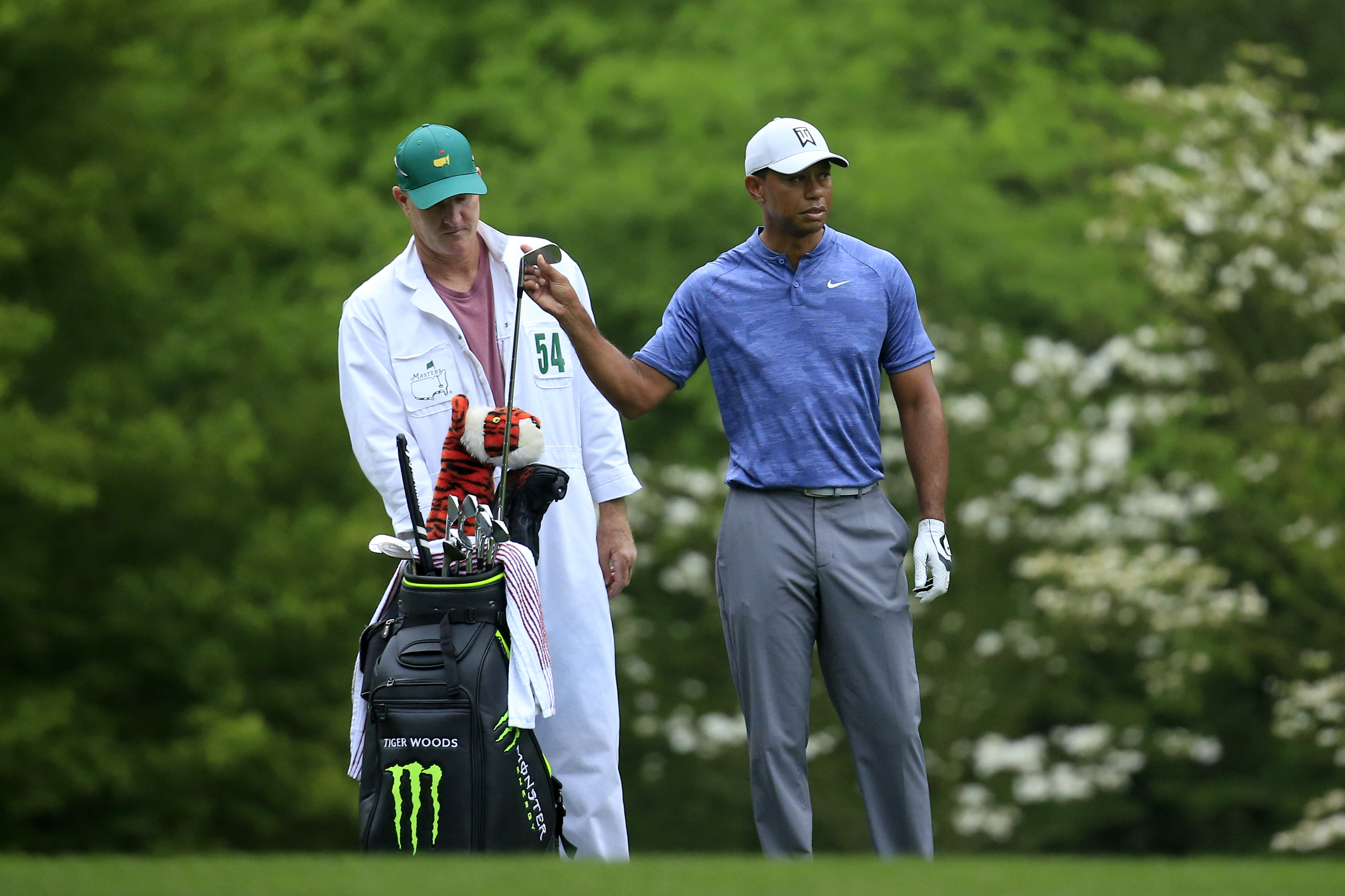 Masters champion Tiger Woods pulls a club alongside caddie Joe LaCava on the No. 11 hole during Practice Round 1 for the Masters at Augusta National Golf Club, Monday, April 8, 2019. (Photo by Augusta National via Getty Images)