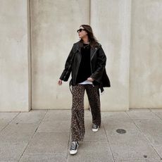 Instagram Trends 2024: Rachael wears leopard print jeans with a leather jacket.
