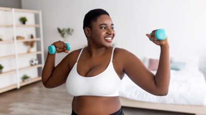 Woman performing a dumbbells workout