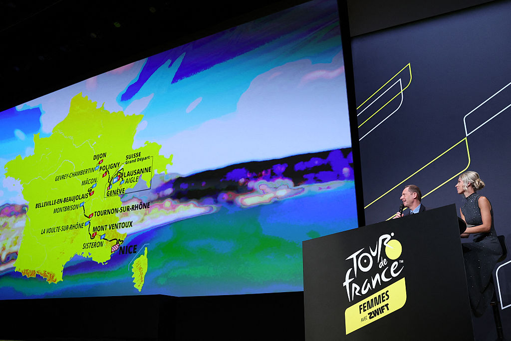 General director of the Tour de France Christian Prudhomme (L) and Director of the women&#039;s Tour de France cycling race Marion Rousse (R) address the audience in front of the map showing the women&#039;s route during the presentation of the official routes of the 2026 edition of the men&#039;s and women&#039;s Tour de France cycling race in Paris on October 23, 2025. (Photo by Anne-Christine POUJOULAT / AFP)
