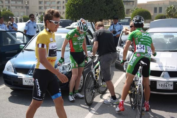 Heinrich Haussler (Garmin-Cervelo) walks past the An Post-Sean Kelly squad.
