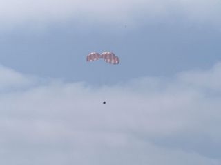 Dragon Descending with Three Parachutes
