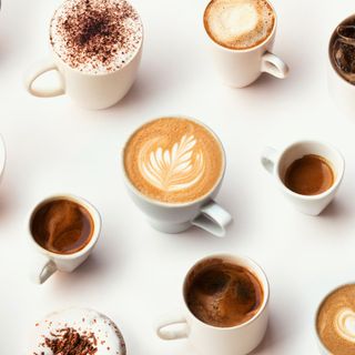 different cups of coffee on a white background