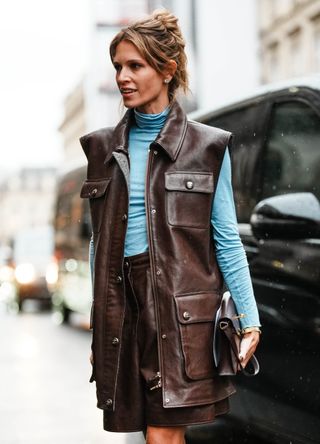 French street style - woman wearing a blue and brown outfit