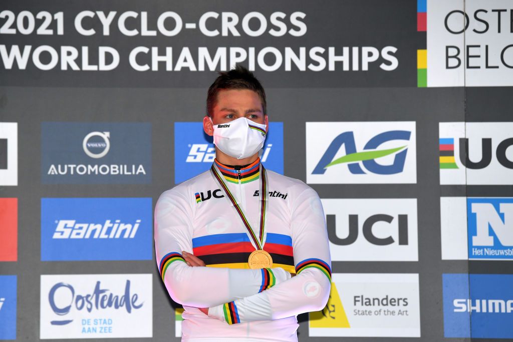 Mathieu van der Poel, winner of the elite men&#039;s UCI Cyclo-cross World Championship in Belgium in 2021, wears a mask to receive his gold medal