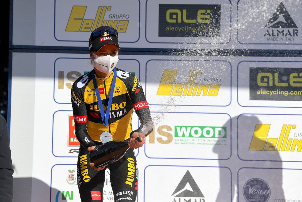 CITTIGLIO, ITALY - MARCH 21: Podium / Marianne Vos of Netherlands and Team Jumbo Visma Celebration, during the 45th Trofeo Alfredo Binda-Comune di Cittiglio 2021, Women's Elite a 141,8km stage from Cocquio Trevisago to Cittiglio 257m / Silver medal / Champagne / Mask / Covid safety measures / #TrBinda / #UCIWWT / on March 21, 2021 in Cittiglio, Italy. (Photo by Tim de Waele/Getty Images)