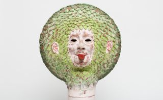 Plant face sculpture with tongue out