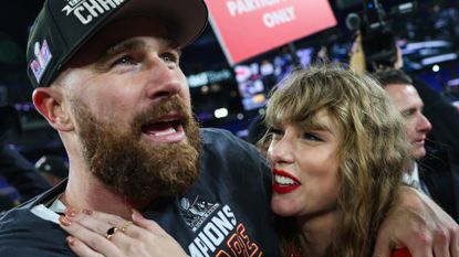 ravis Kelce #87 of the Kansas City Chiefs (L) celebrates with Taylor Swift after defeating the Baltimore Ravens in the AFC Championship Game at M&T Bank Stadium on January 28, 2024.