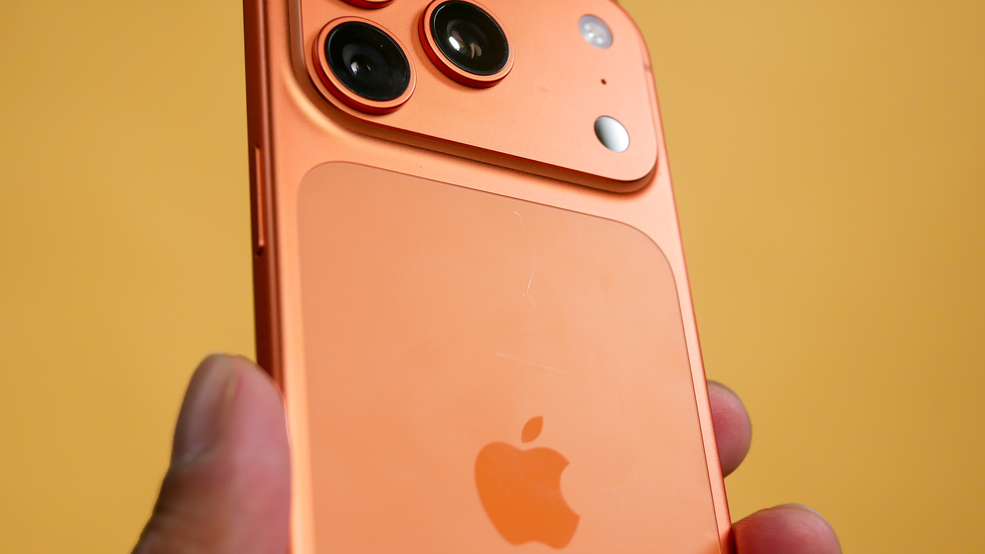 iPhone 17 Pro showing superficial scratches.