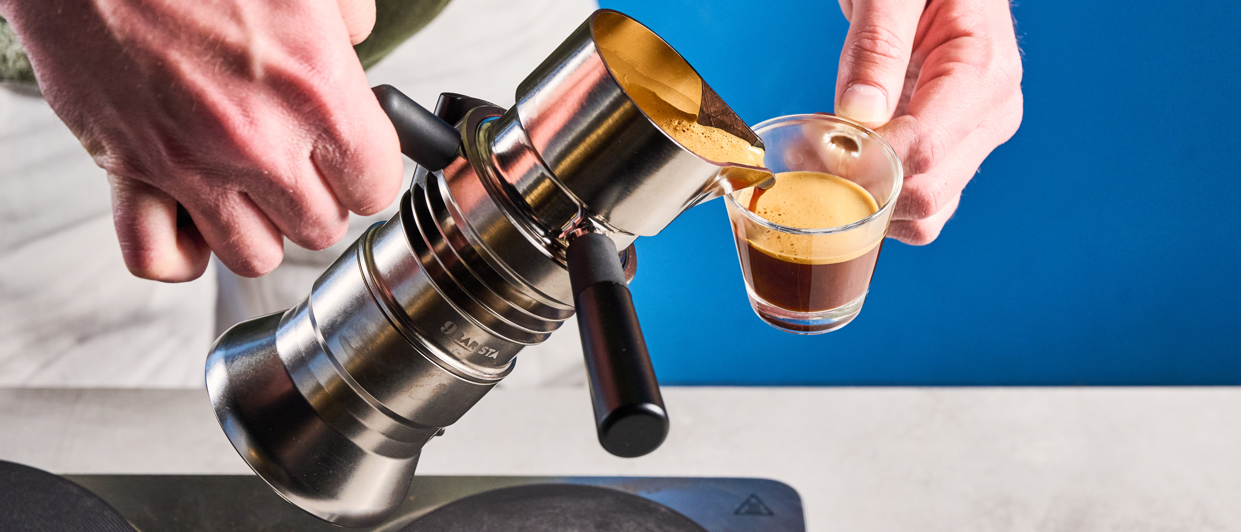 A photo of the 9Barista Espresso Machine Mk.2 against a blue background