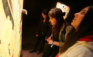 Members of the Tate Forum run a pilot event for the Louis Vuitton Young Arts project during Chris Ofili's exhibition