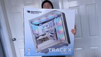 iBUYPOWER Trace X pre-built gaming PC in box, held in hands