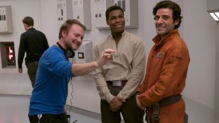 Rian Johnson, John Boyega and Oscar Isaac on the set of Star Wars: The Last Jedi