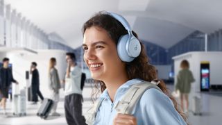 Woman wearing Anker Soundcore Space One headphones lifestyle.