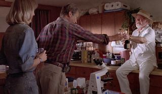 Jurassic Park Hammond toasts Grant and Sattler in their trailer