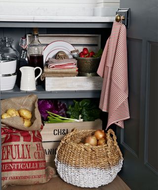 grey cupboard for storing veggies and essential items