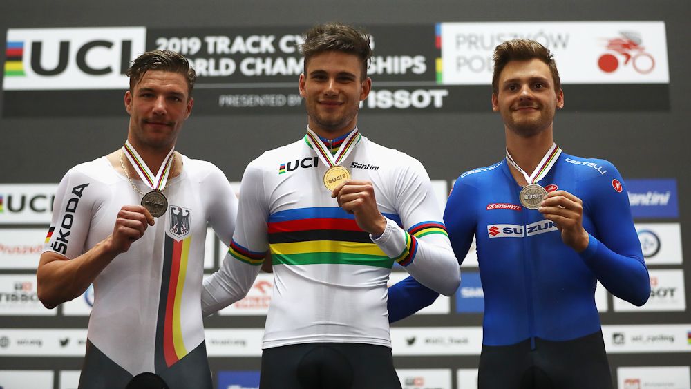 Domenic Weinstein of Germany (silver medal), Filippo Ganna of Italy (gold) and Davide Plebani of Italy (Bronze) celebrate on the podium for the Men's individual pursuit