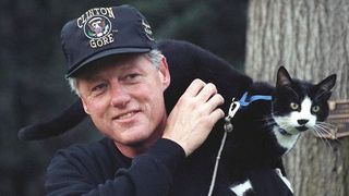 Bill Clinton and his cat Socks on his shoulder