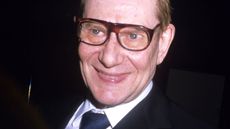 Yves St. Laurent on a black background