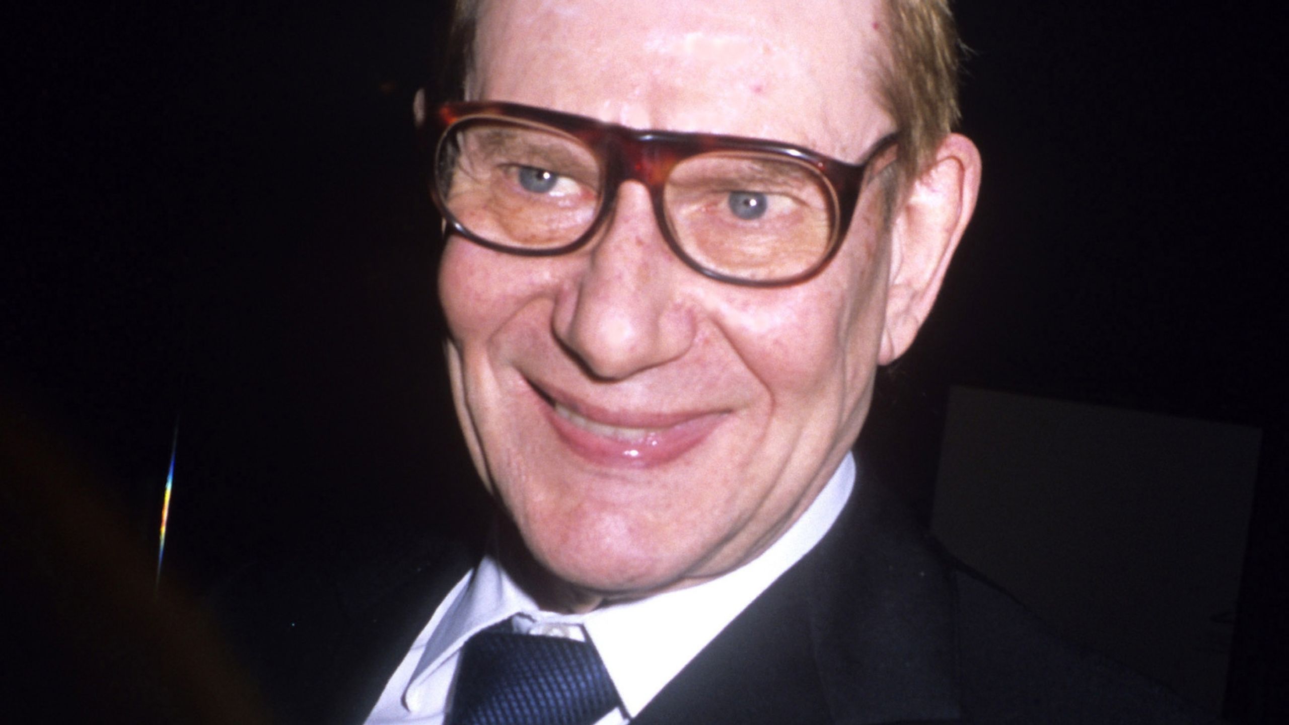 Yves St. Laurent on a black background