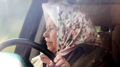 Queen Elizabeth II drives herself in her Range Rover car as she attends day 3 of the Royal Windsor Horse Show in Home Park on May 10, 2019