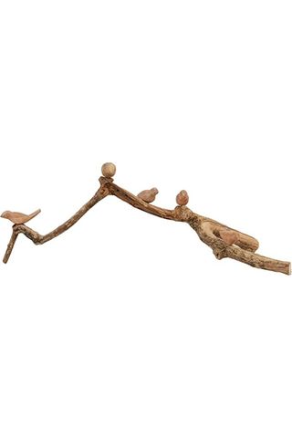 decorative wooden carving of birds on a branch