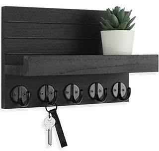 Decorative black Key and Mail Holder With Shelf Has Large Hooks.One set of keys and succulent in white pot shown