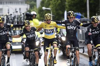 Chris Froome and his teammates celebrate during Stage 21 of the 2015 Tour de France